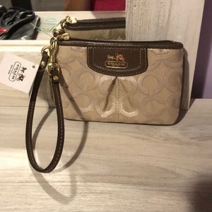 Khaki/beige Coach wristlet. NWT.